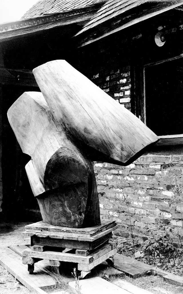 Untitled [View of Raoul Hague's sculpture "Angel Millbrook Walnut"]