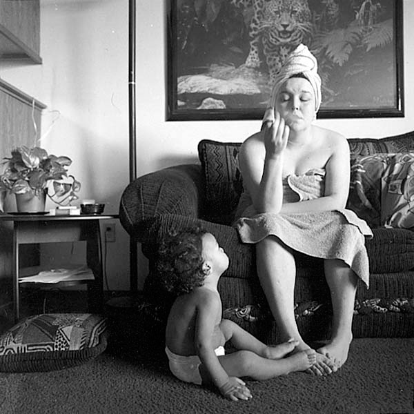 Tiny at thirty on the couch, smoking with Ray Shon, her baby, Seattle