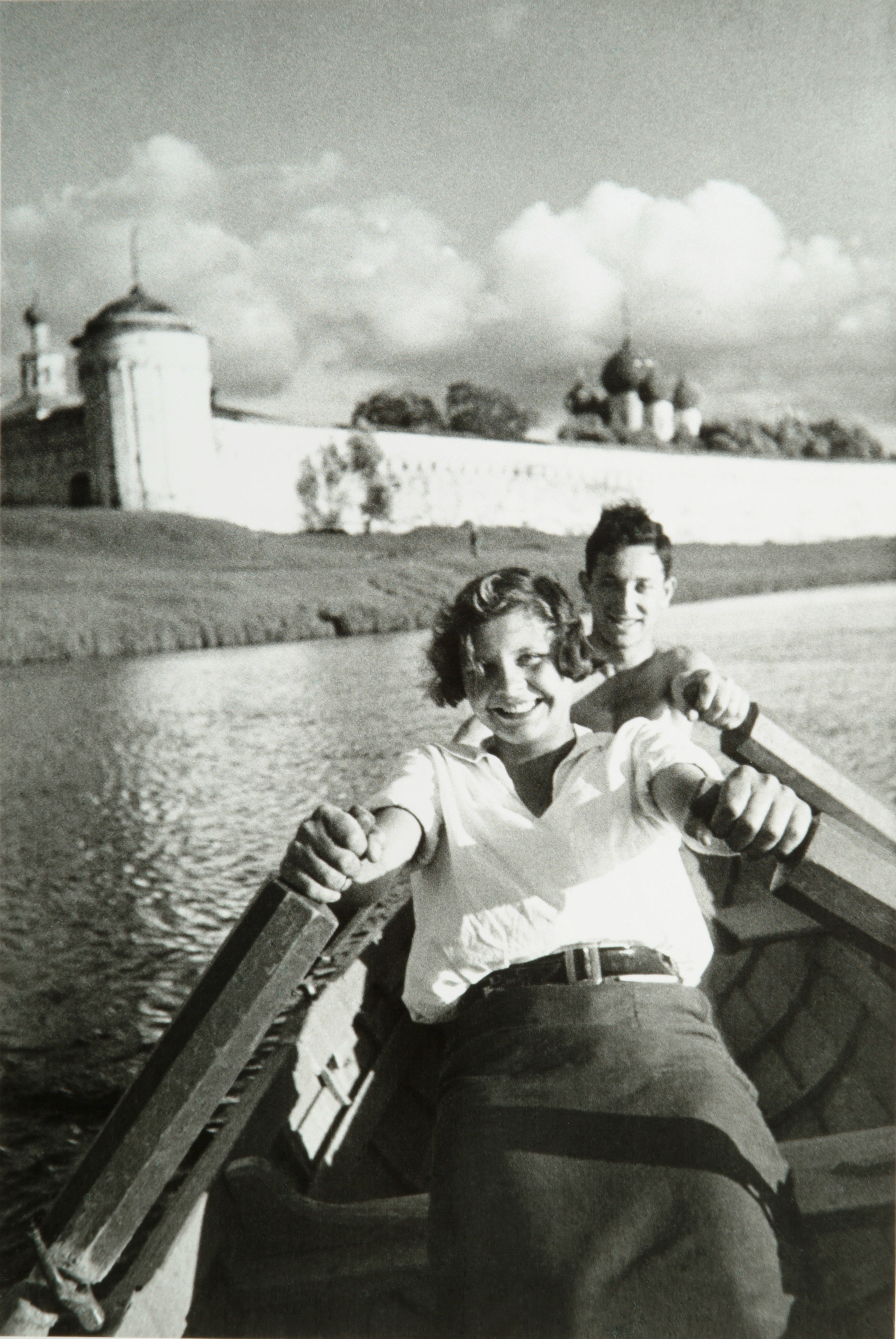 Youths rowing along the walls of the Kalazinsky Monastery