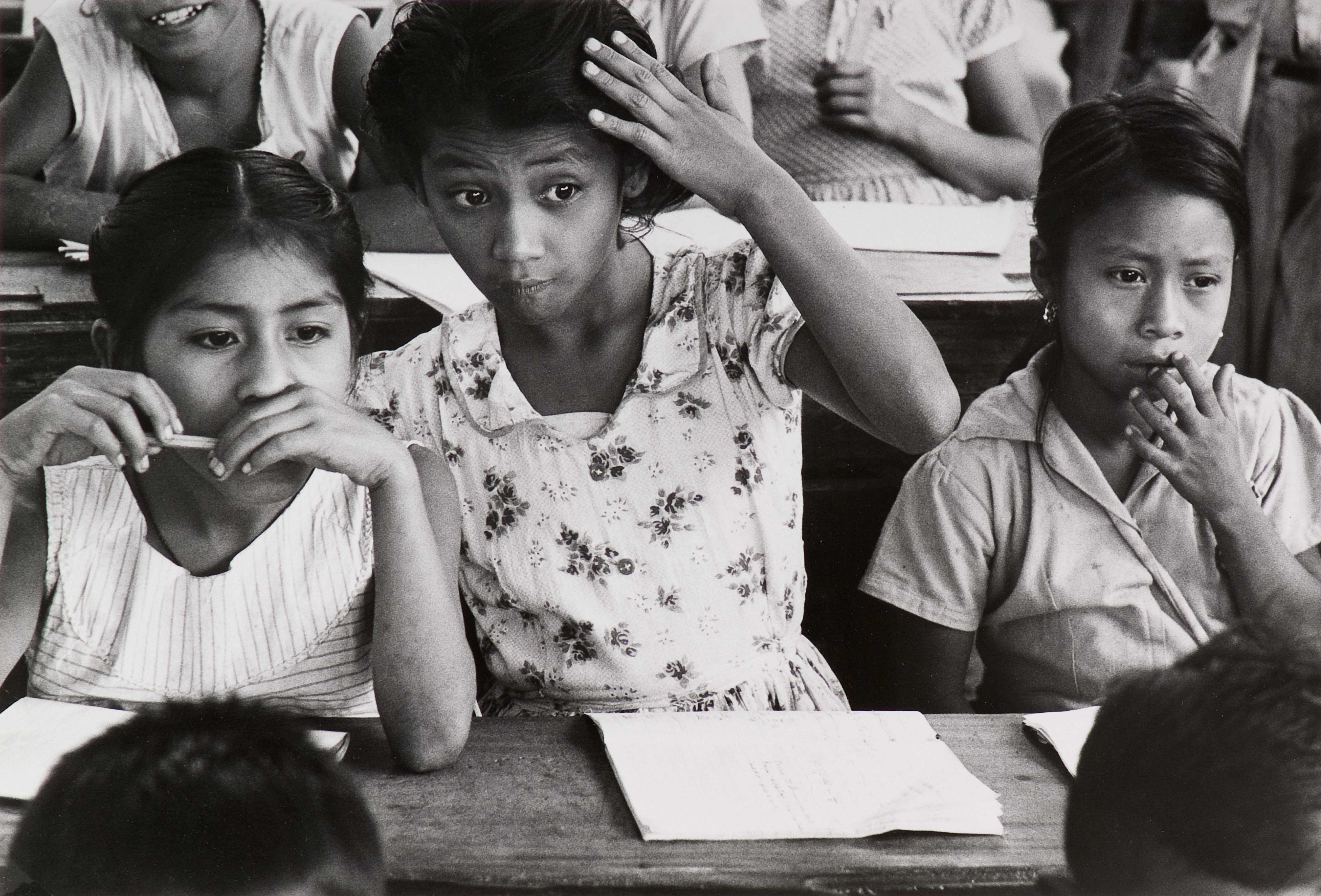 Three girls sititng in classroom in El Salvador