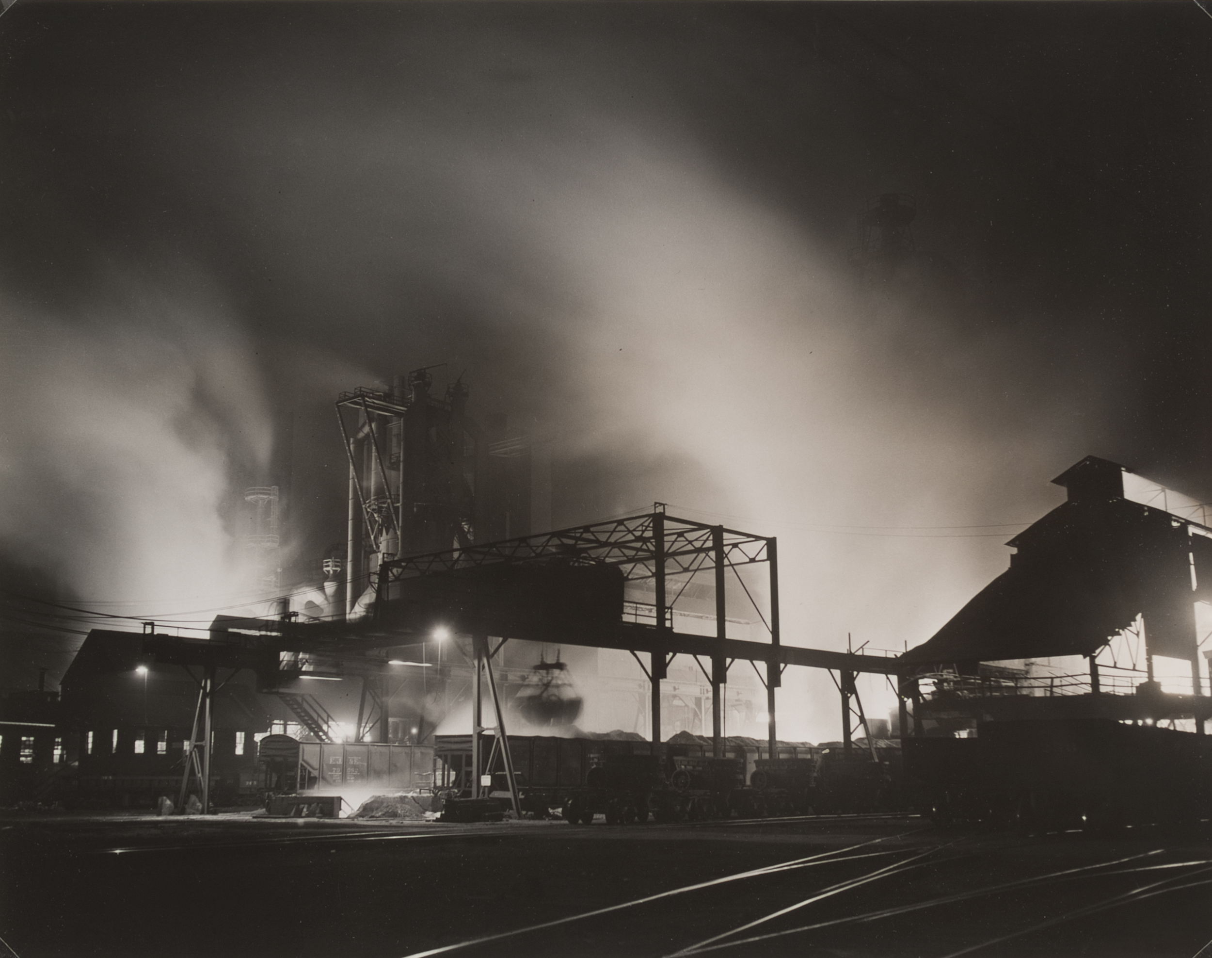 Industrial plant, railroad car, at night