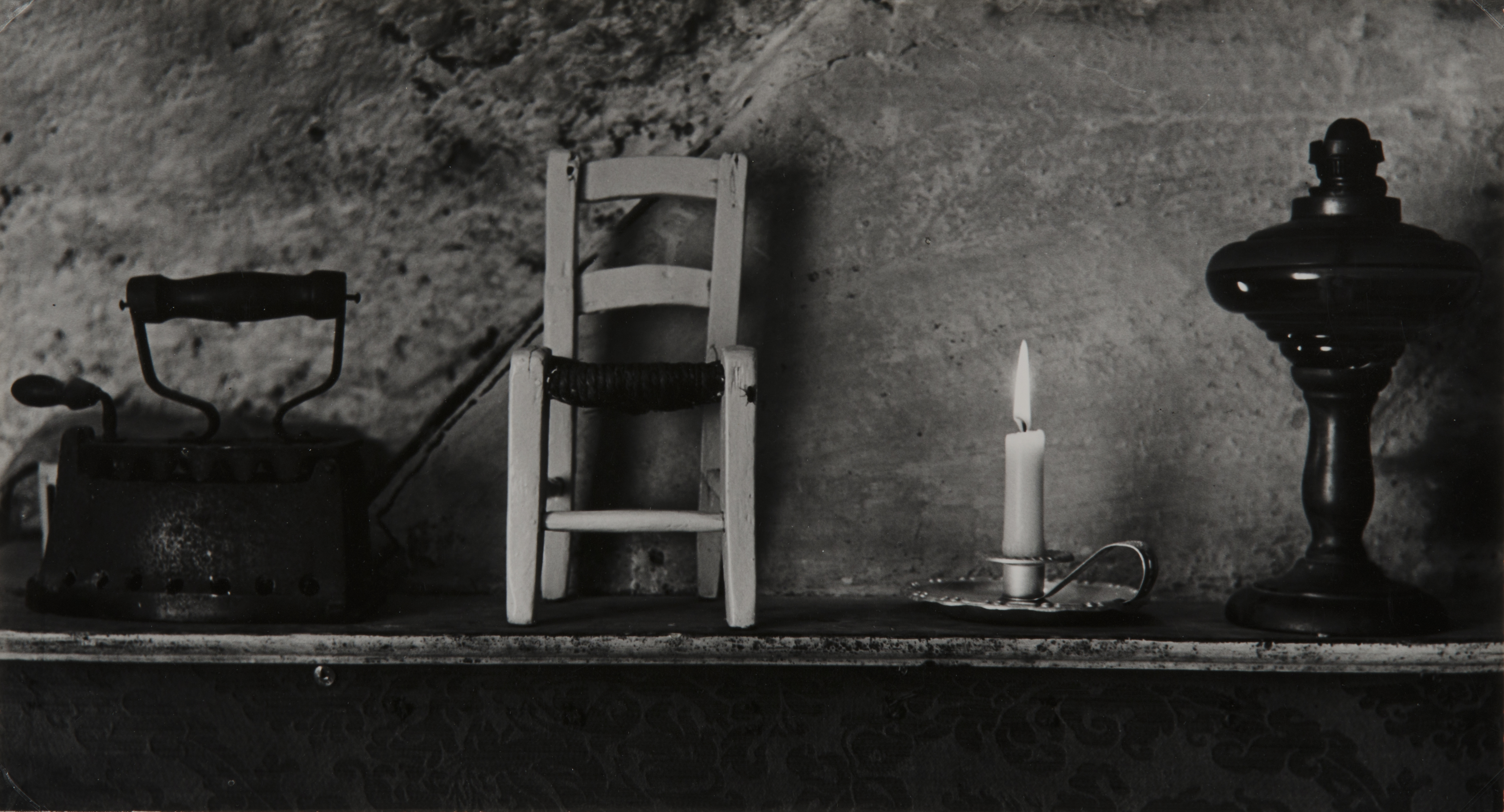 Composition (Iron, miniature chair, candle and ?)