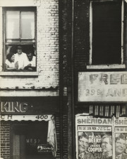 Untitled [Three People at Window, Facade Covered with Billboards]