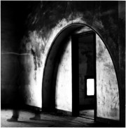 Untitled [Arched doorway with ghost]