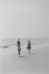 Untitled [Women doing yoga on the beach]
