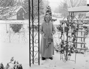 Marjorie Angel in her front yard with snow, Akron, Ohio