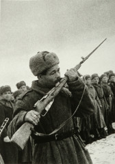 The Oath of War (Soviet soldier kissing his rifle)
