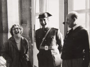 Woman laughing, officer and gentleman smiling