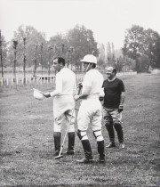 Three polo players, standing