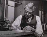 Chemist Julius V. Sommer charging micro-pyconmeter...
