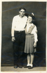Untitled [Standing couple, arm around shoulder]