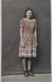 Untitled [Smiling young woman in flowered red dress]