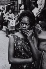 Young woman on street, Harlem, NYC