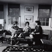 White House secretaries Jill S. Cowen, Priscilla Wear, and Phyllis Mills sitting on couch drinking coffee