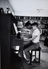 Press Secretary Pierre Salinger playing piano with son Marc