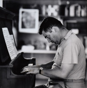 Press Secretary Pierre Salinger playing piano