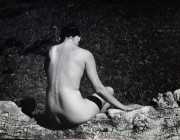 Nude seating on log (Joan), Carmel Valley, California