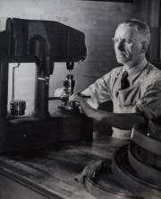Machinist testing hardness of ruler, Wilson Mechanical Instrument Company, Bronx, New York