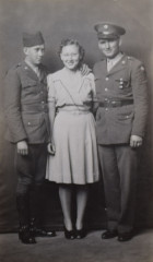 Untitled [Two soldiers with woman, standing]