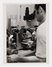 An electronic microscope takes photos of the pistol barrel. Items are microscopically tested to show indentations and markings found on the weapon and on the bullet, NYC