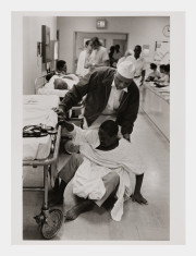 Doctor helping drug addict on the floor, NYC