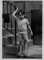 Boy holding railing, NYC