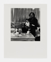 Untitled [Man and Baby Seated on Sofa]