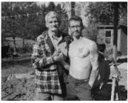 (l. to r.) Leroy and Keith Morlan, father and son clasping hands, Norton, Ohio
