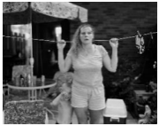 Lerrynn Hummel and son, Paul Massey, on patio of her grandmother’s apartment, where she’s temporarily staying, Valleyview Apartments, 31st Street, Barberton, Ohio