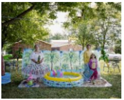 Grandmother, Sandra Vitone; mother, Arathea Booth; and granddaughter, Elizabeth Dunn,  with pool and palm tree backdrop, Marshallville, Ohio